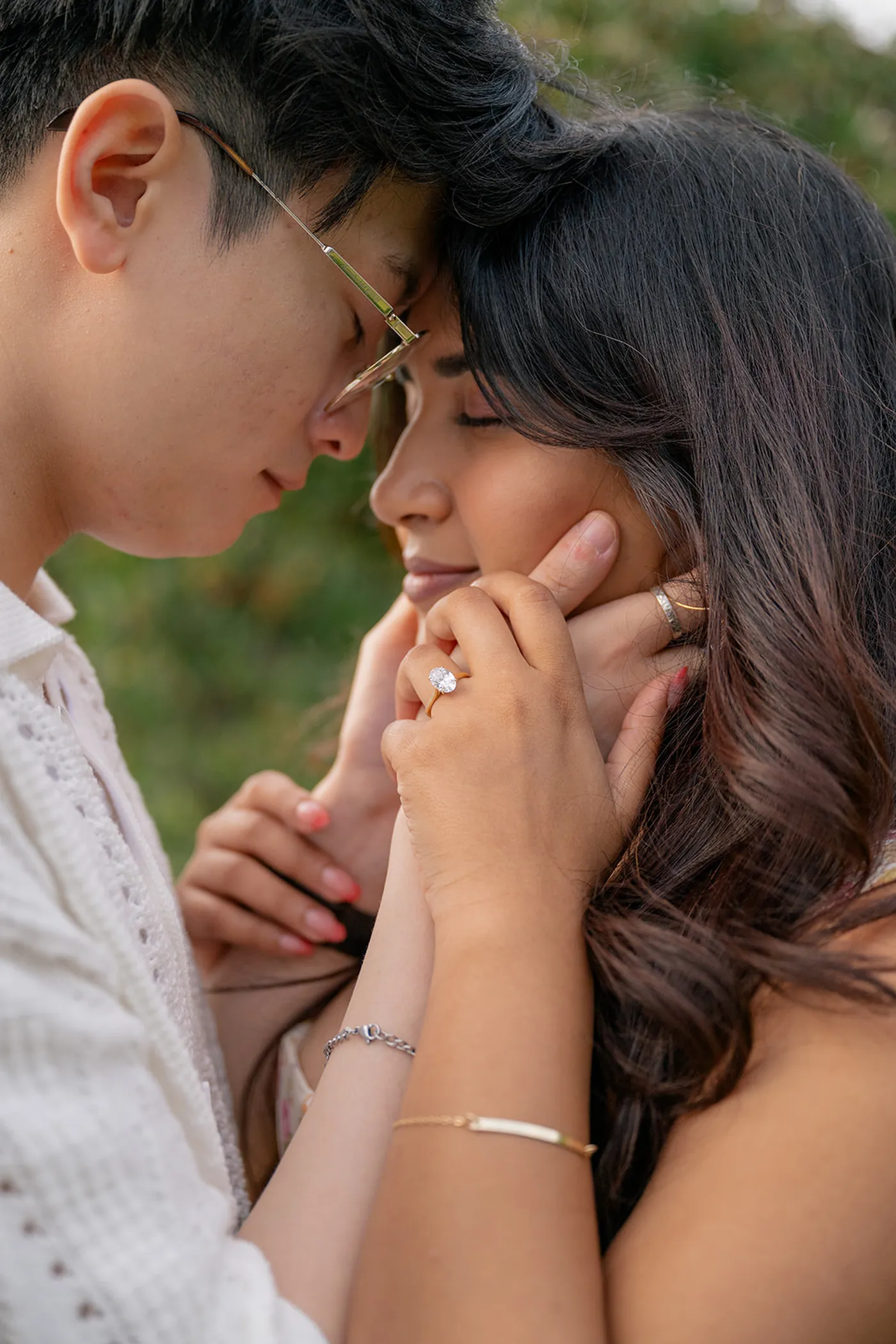 Candid moment of joy after a surprise engagement in VanDusen Botanical Garden, Vancouver.