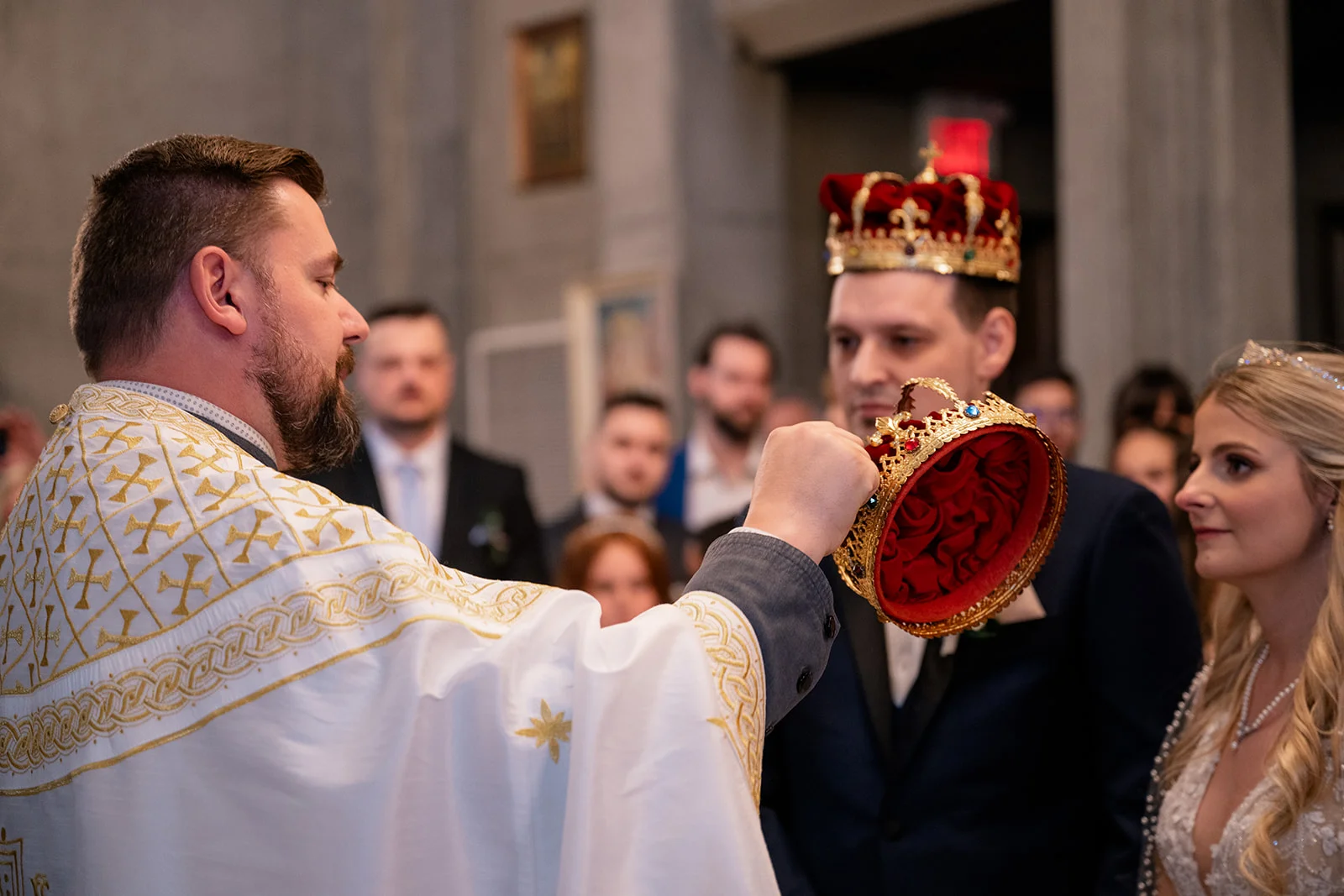 Serbian Orthodox wedding ceremony with traditional rituals including candles, crowns, and cords