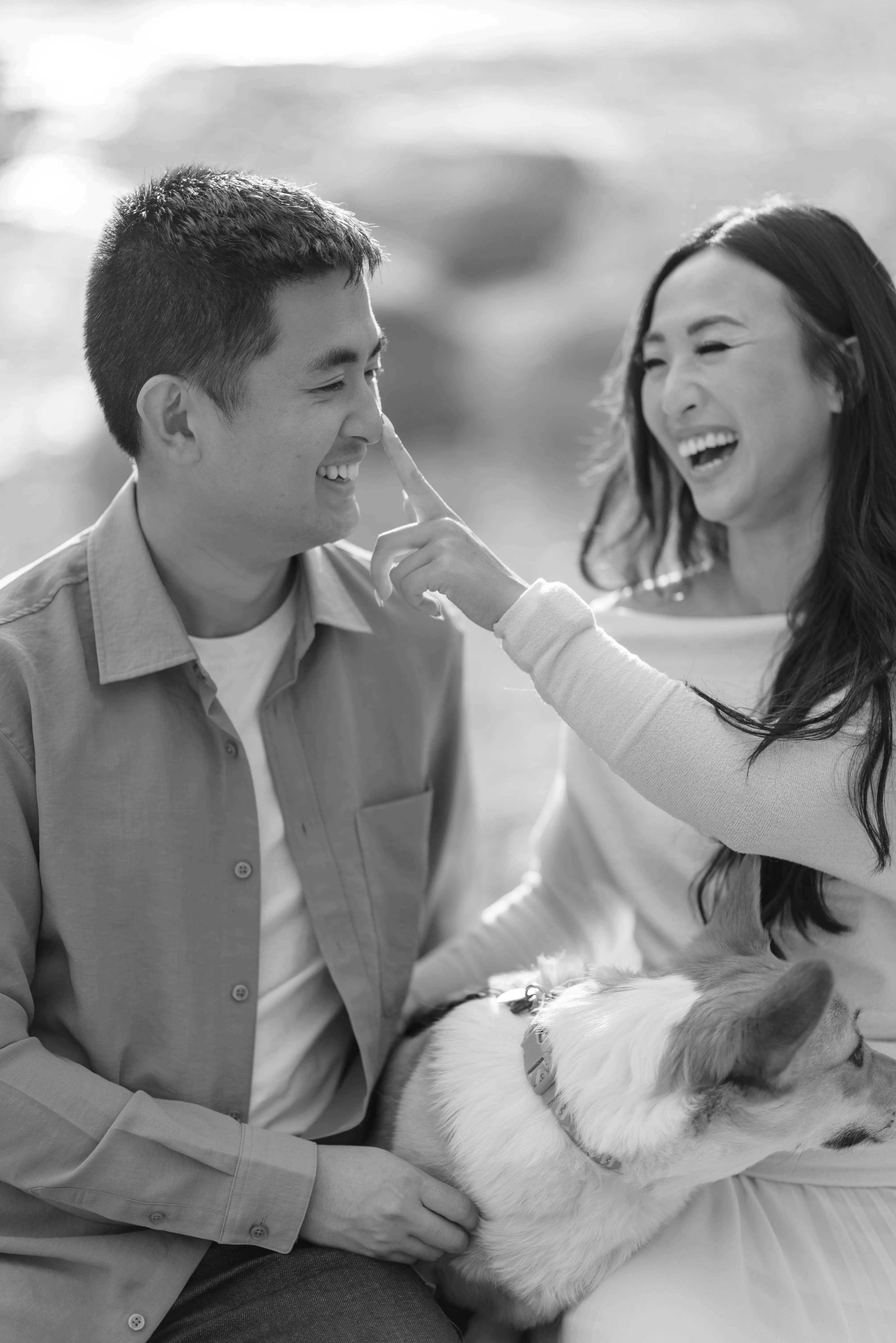 Couple laughing together during outdoor photoshoot in Calgary park