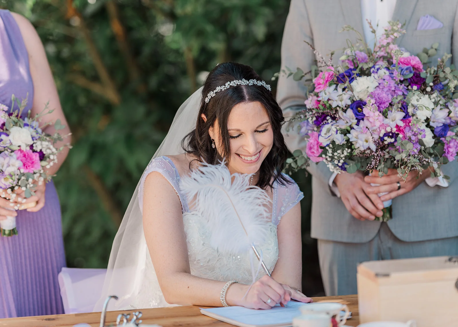 bride signing wedding certification at a summer backyard wedding in mission, british columbia