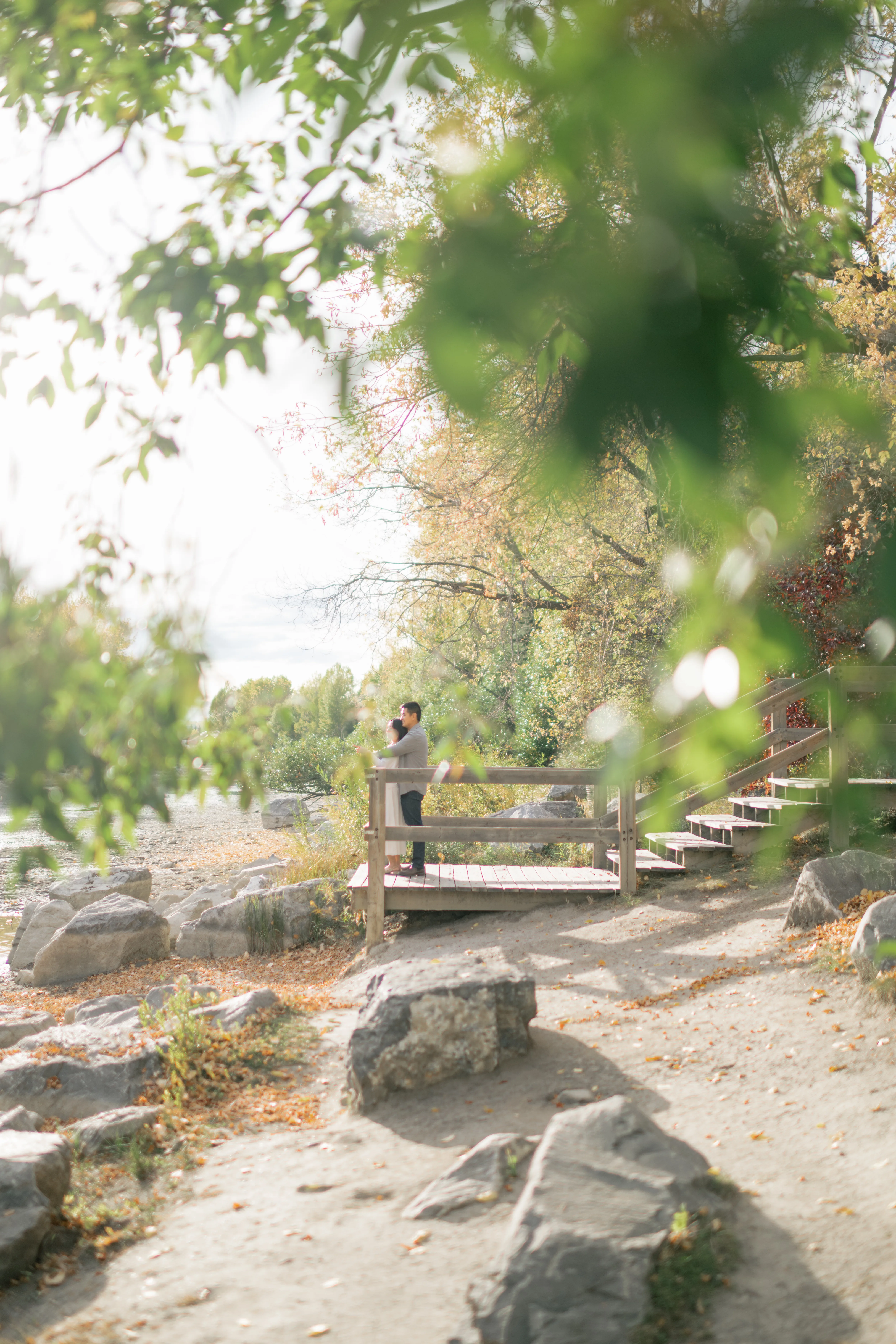 Romantic couples photo with Bow River background in Calgary