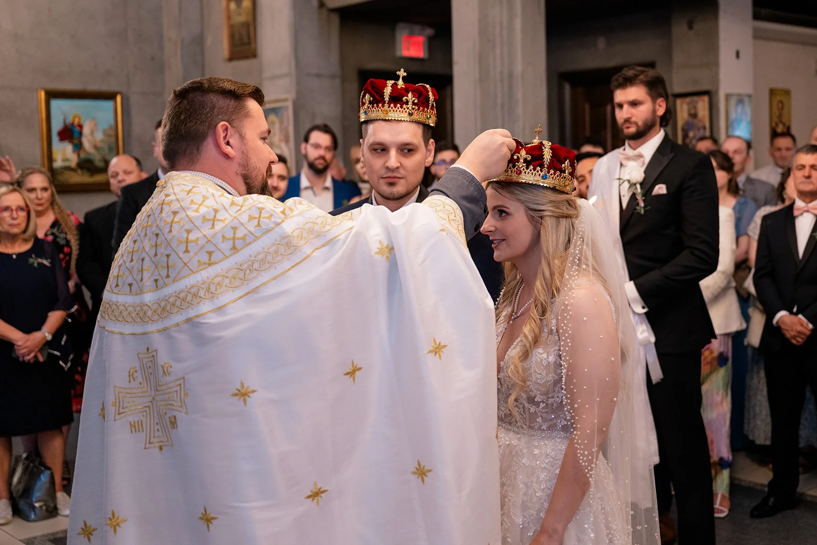 Serbian Orthodox wedding ceremony with traditional rituals including candles, crowns, and cords