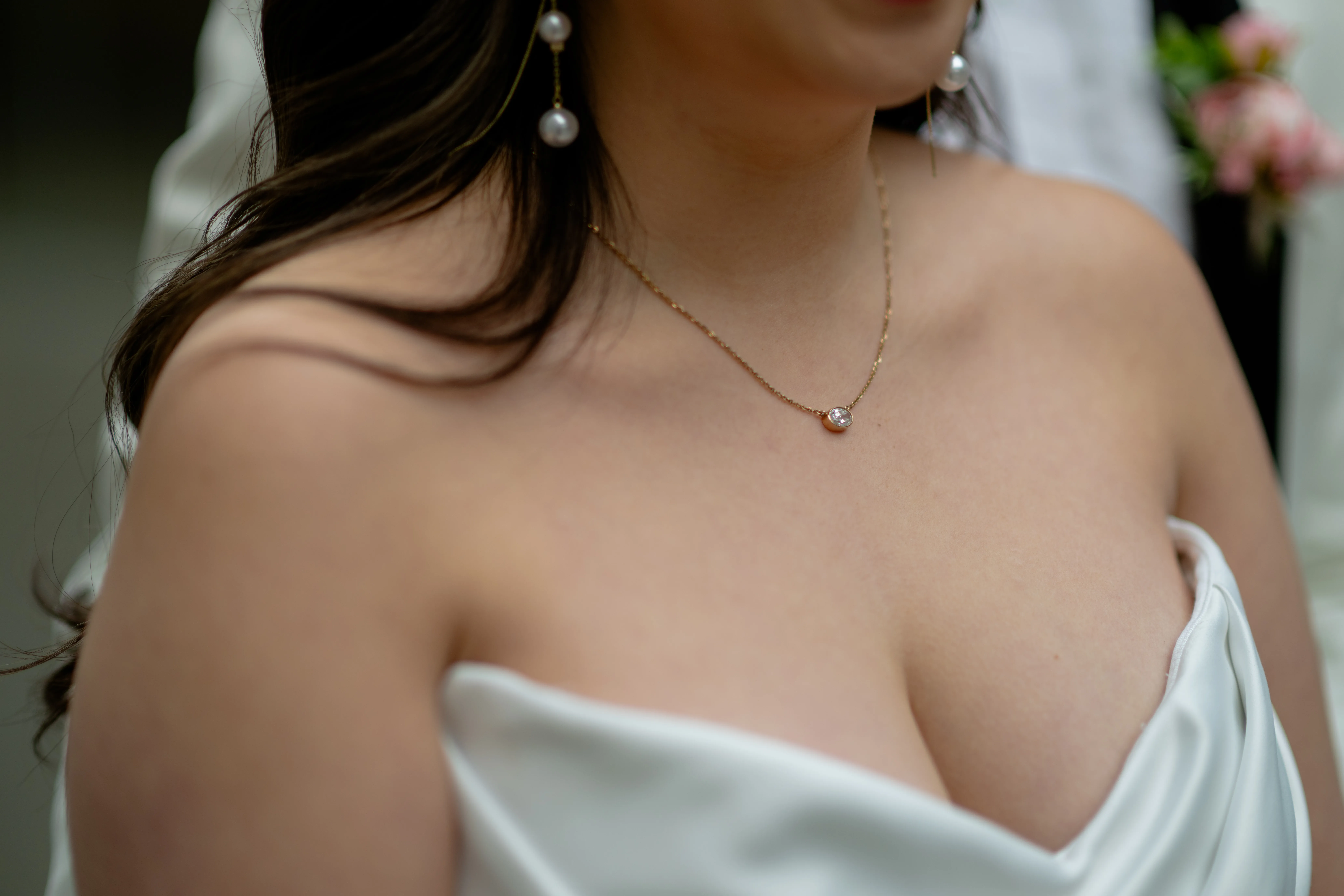 Close-up bridal portrait highlighting neckline and natural light
