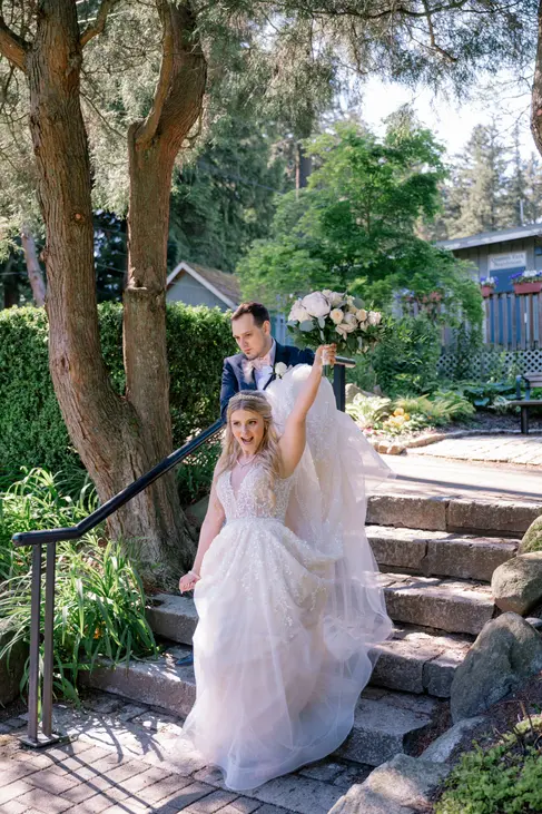 Magical couple portraits in a serene forest setting, with the bride and groom surrounded by towering trees and dappled sunlight