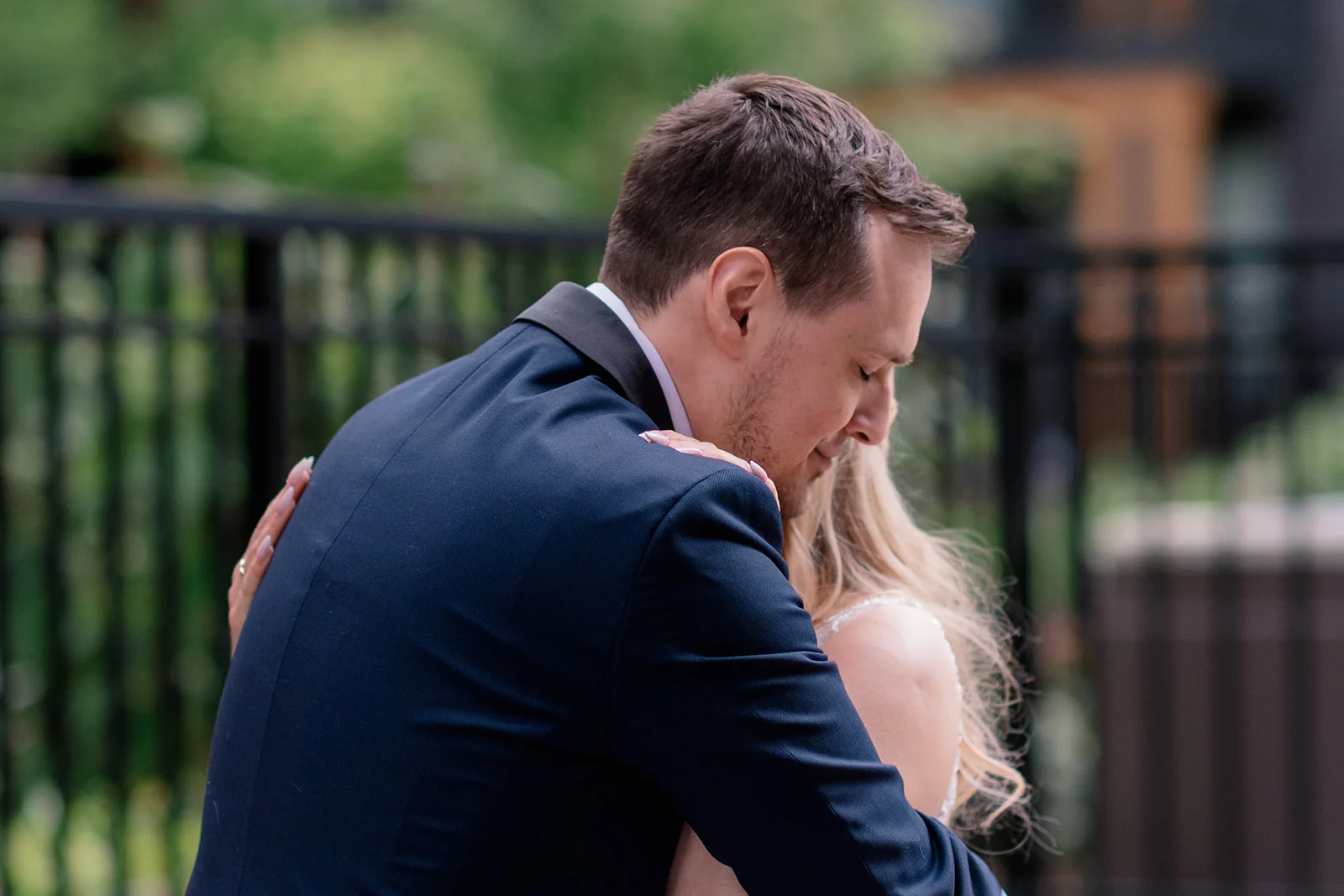 Close-up of bride and groom's faces, capturing their emotional reactions during the first look