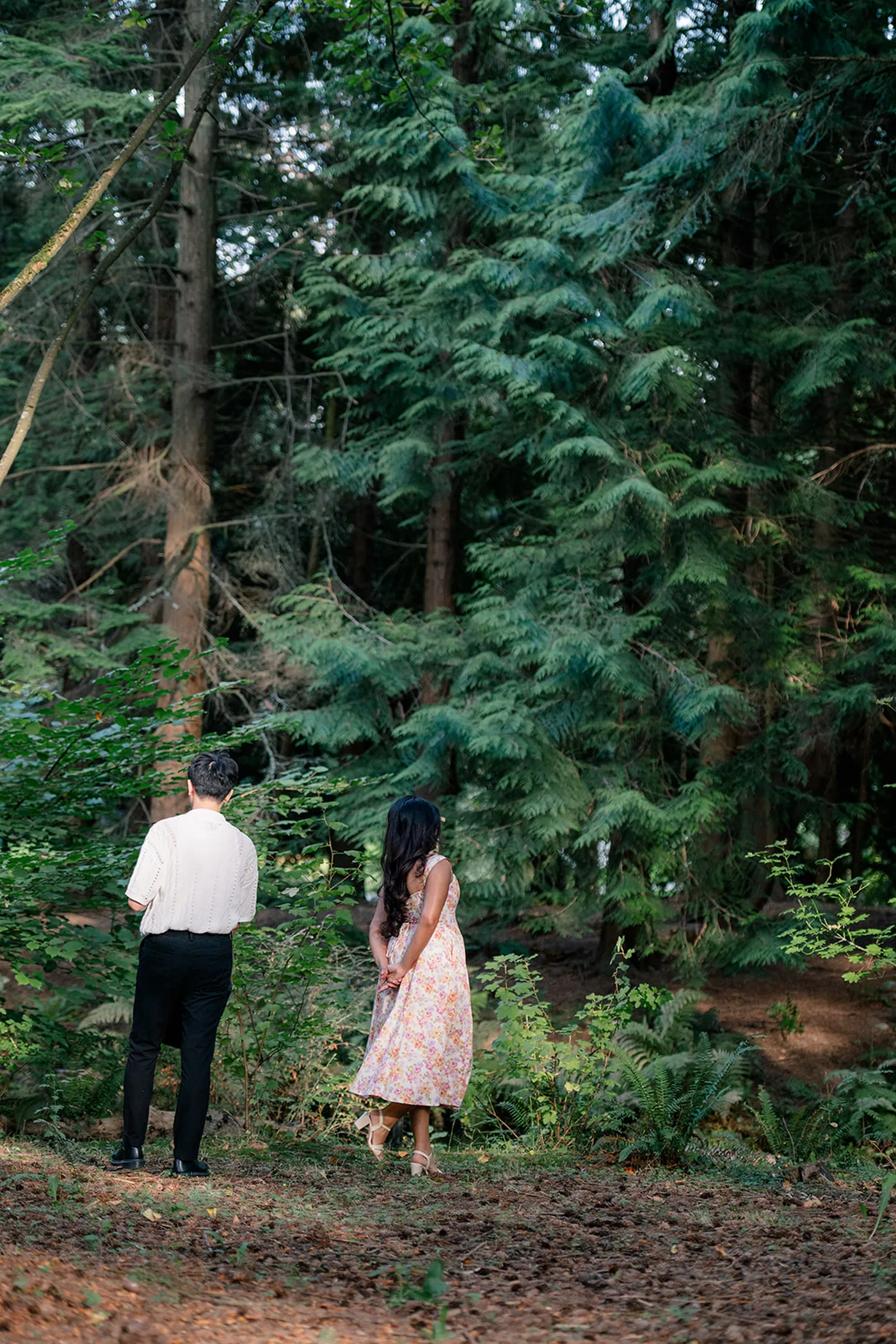 Romantic surprise proposal in VanDusen Garden with lush greenery and blooming flowers as the backdrop
