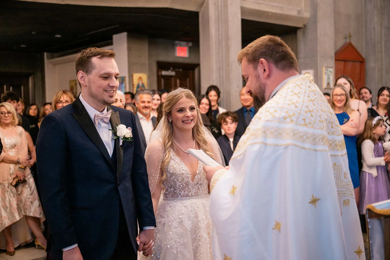 Serbian Orthodox wedding ceremony with traditional rituals including candles, crowns, and cords