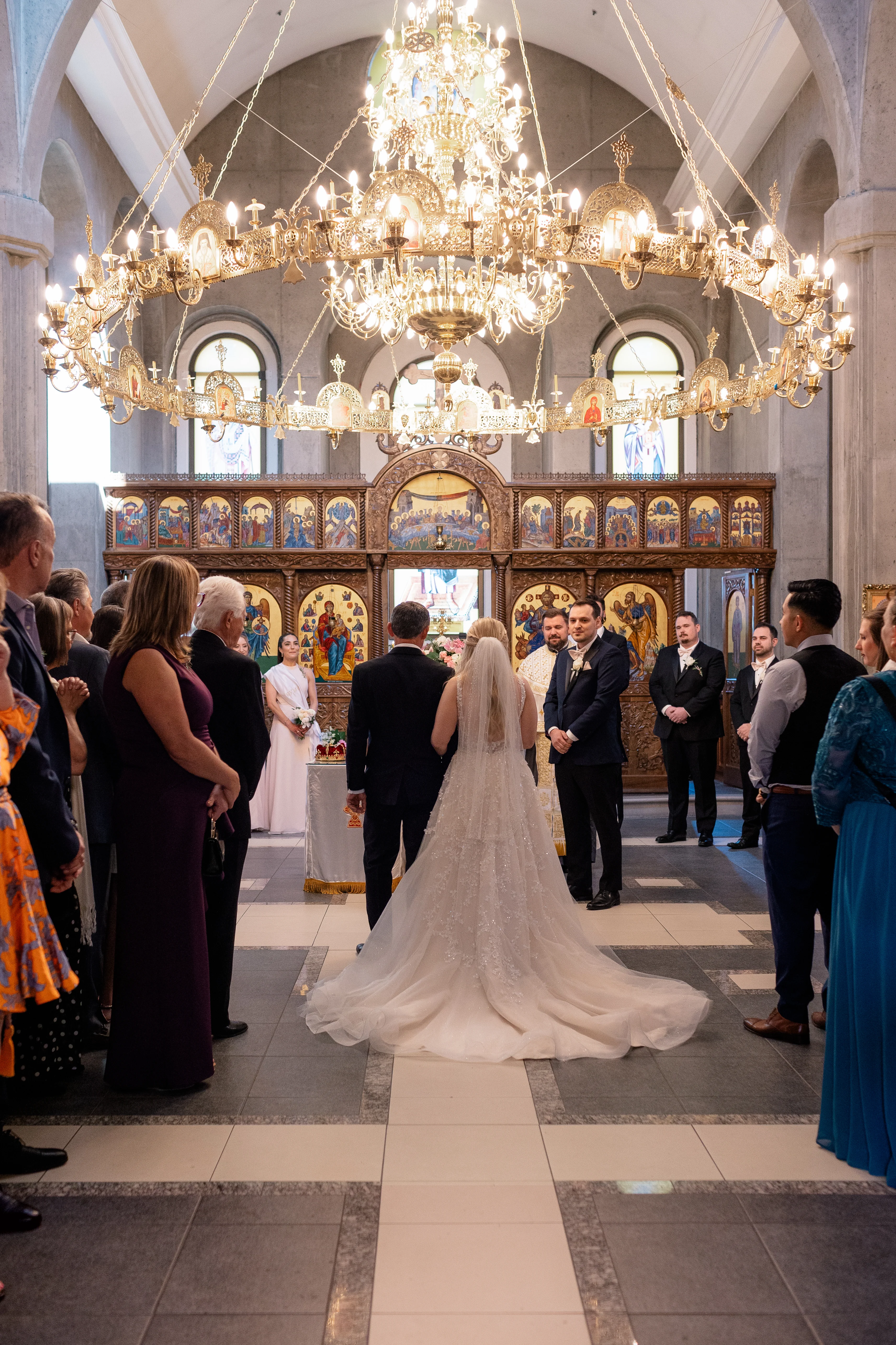 Serbian Orthodox wedding ceremony with traditional rituals including candles, crowns, and cords