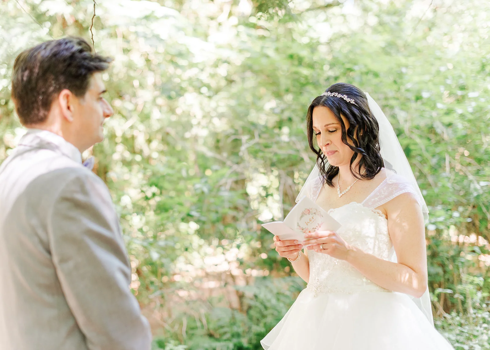 bride reading her vows to groom at a summer wedding in mission, british columbia