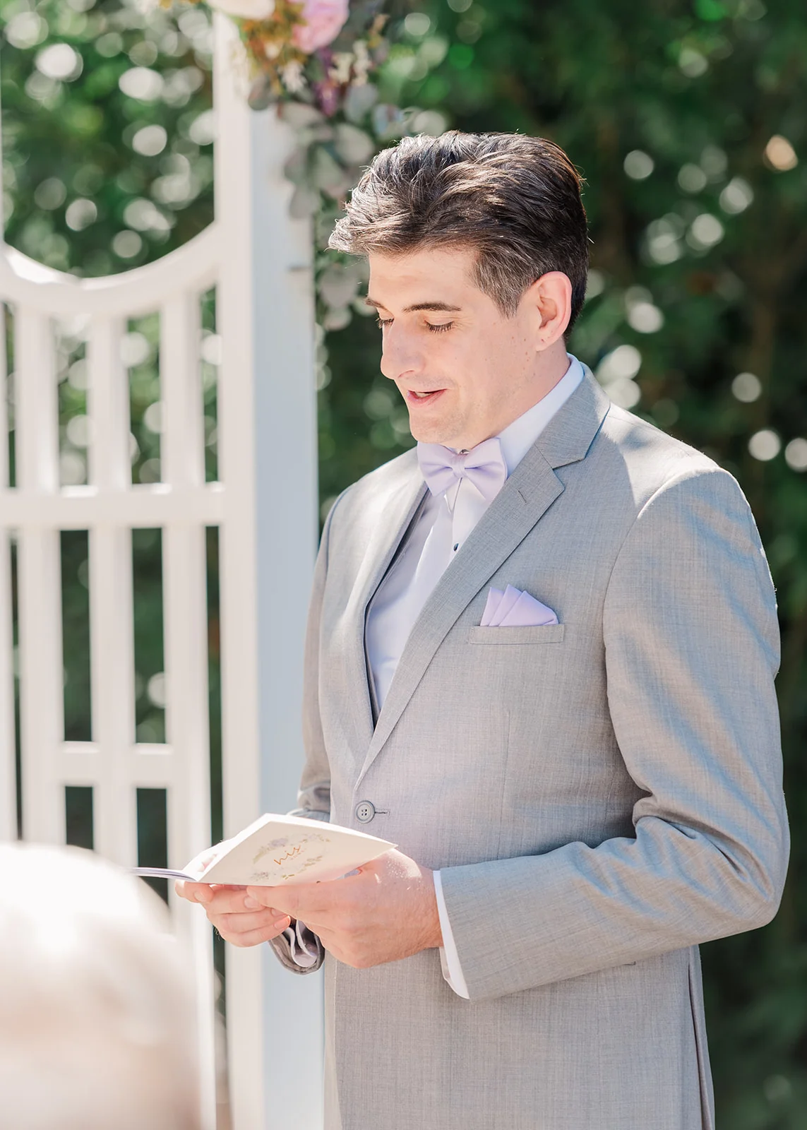 groom reading vows in intimate backyard wedding summer in mission, british columbia