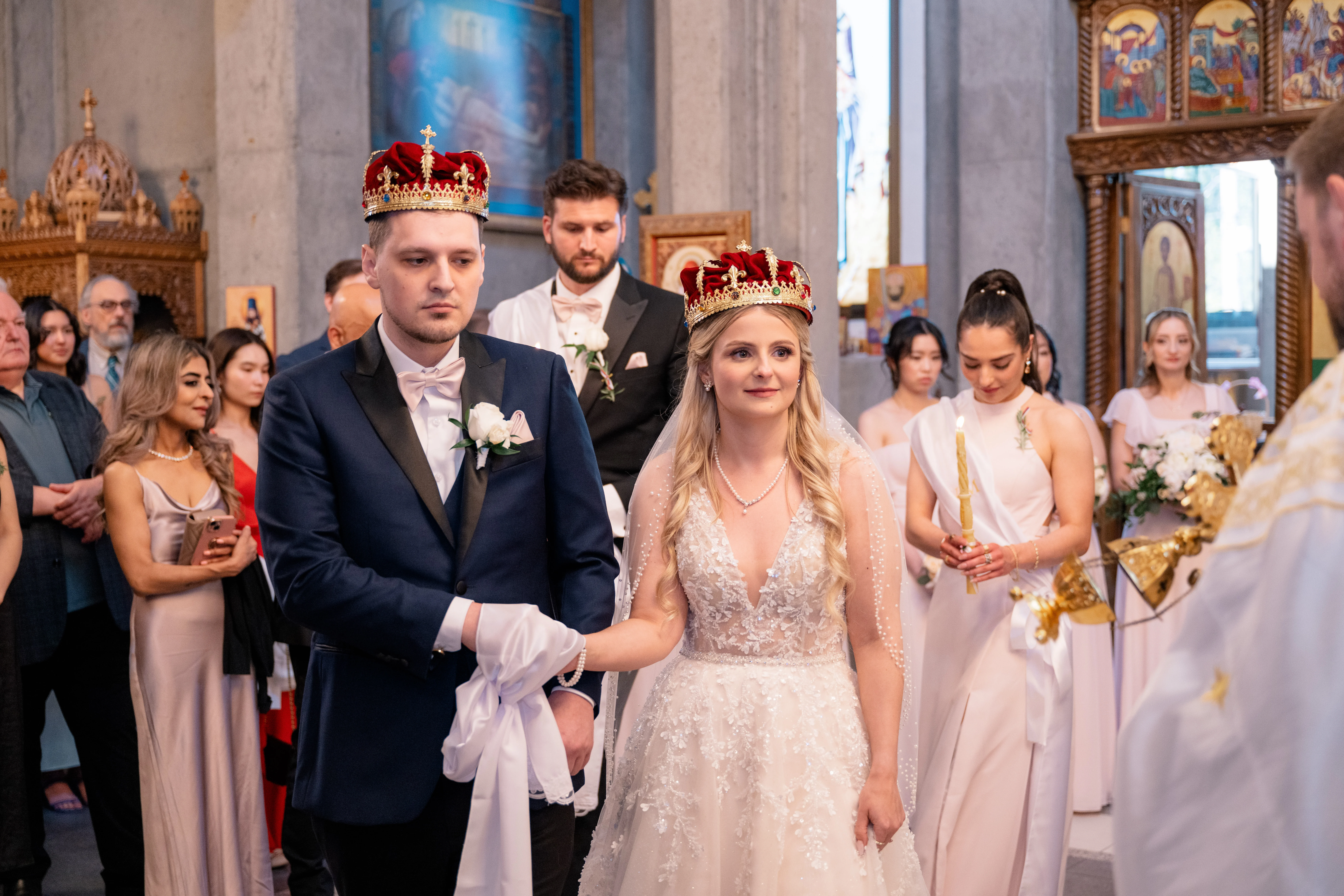 Serbian Orthodox wedding ceremony with traditional rituals including candles, crowns, and cords