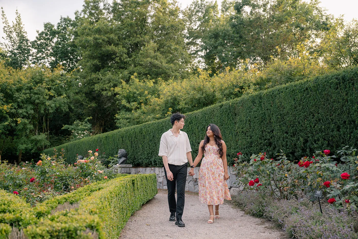 Surprise proposal photography in Vancouver, capturing love amidst the greenery of VanDusen Garden.