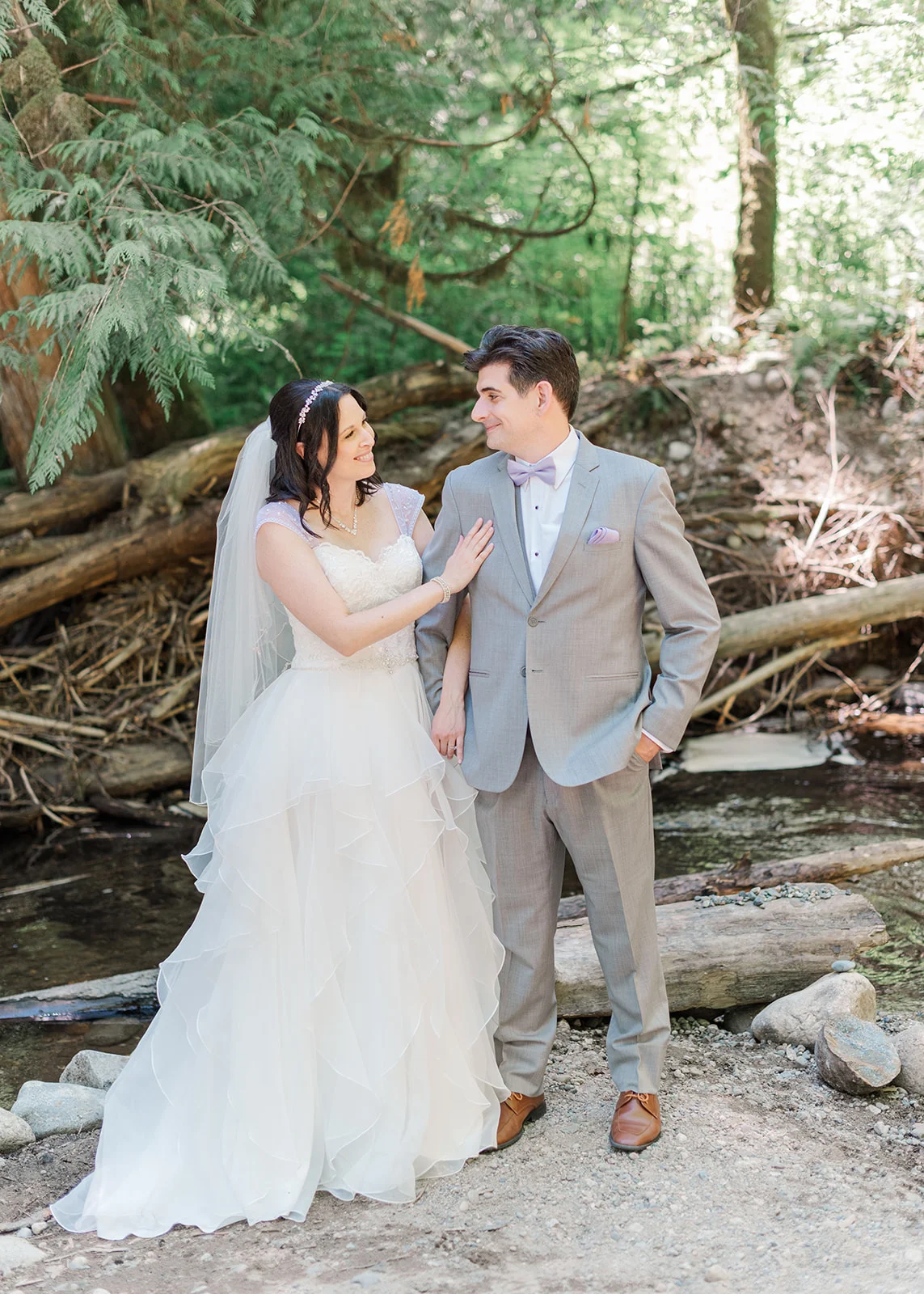 bride and groom looking at each other lovingly in a summer wedding in mission, british columbia