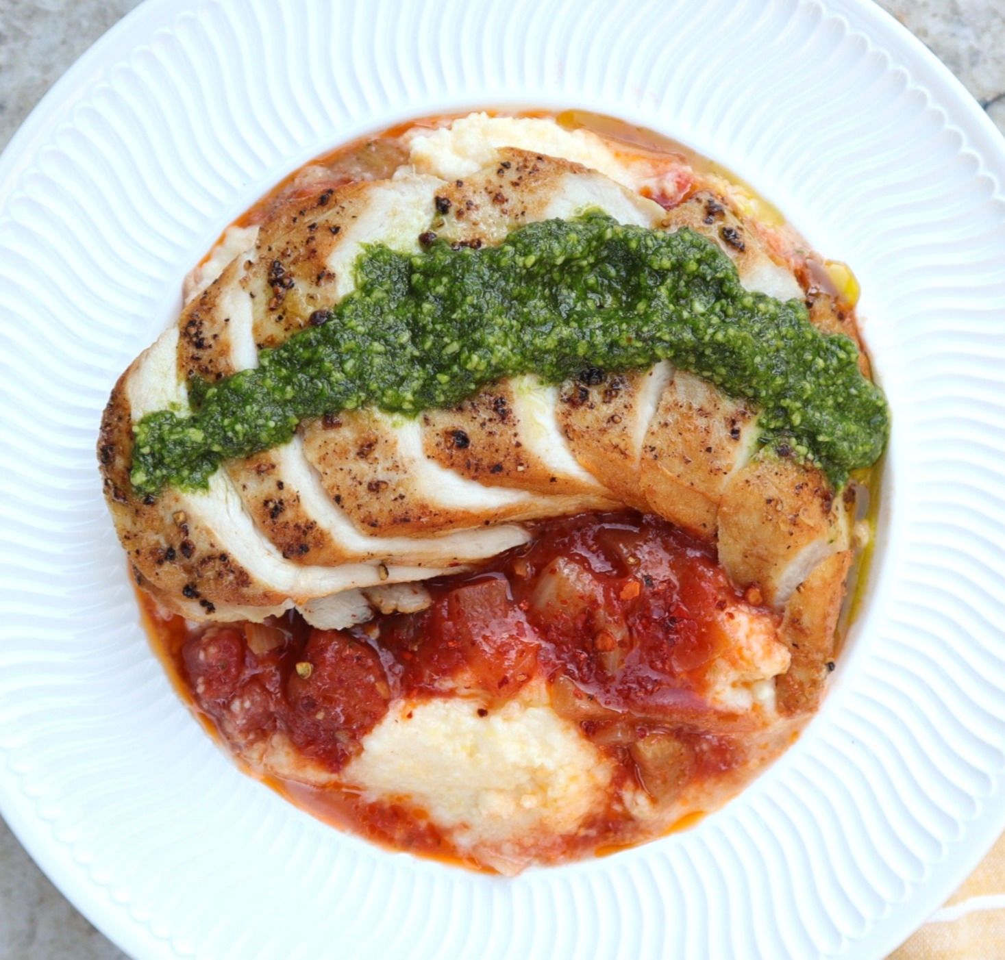 Pesto Chicken Breast with Creamy Polenta & Tomato-Fennel Ragout