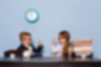 A girl and a boy in an office completing a task together and being colaborative.