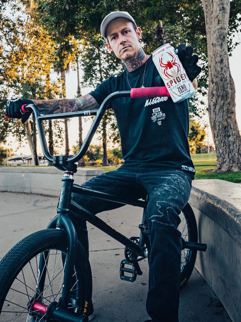 Biker holding a Spider Energy Drink Zero Citrus Bite Twist