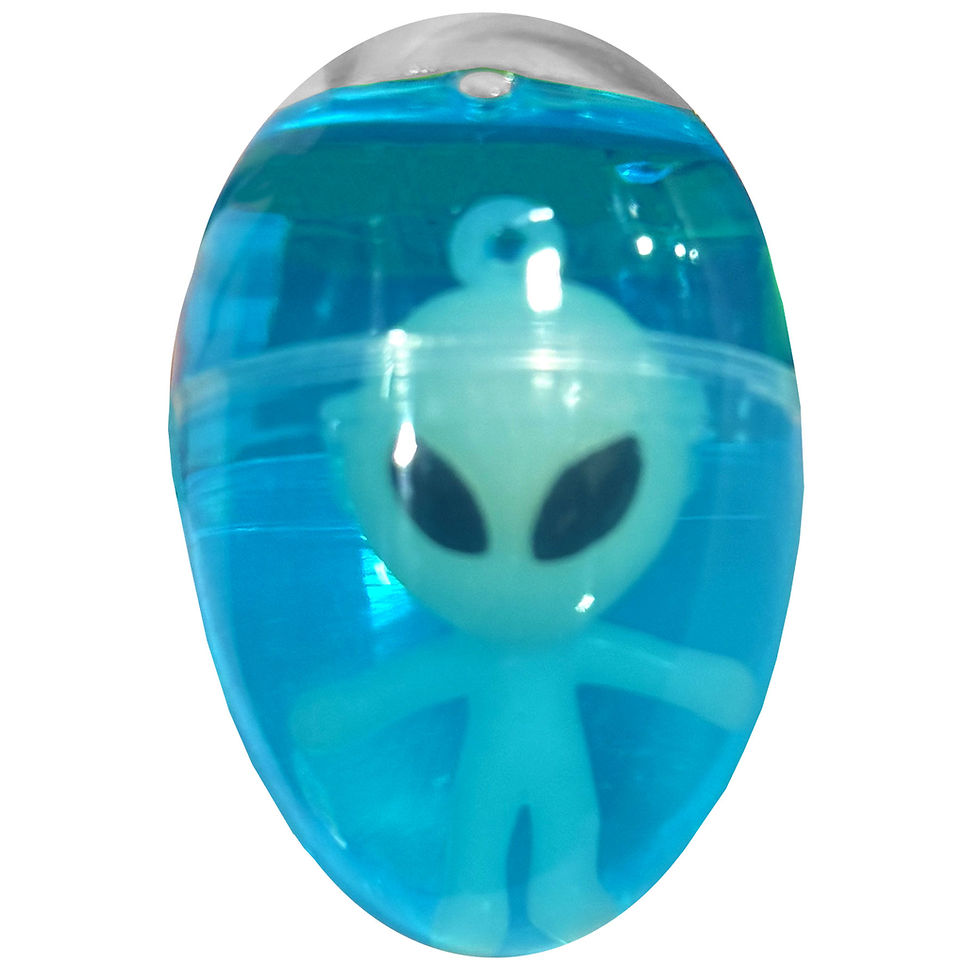 Glow in the dark alien toy inside a blue translucent putty egg