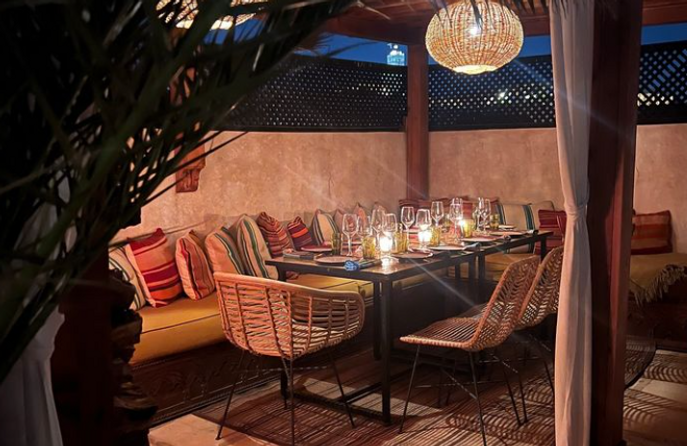 The terrace by night laid for dinner
