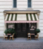Café Aureum café branding and storefront design featuring striped awning and signage