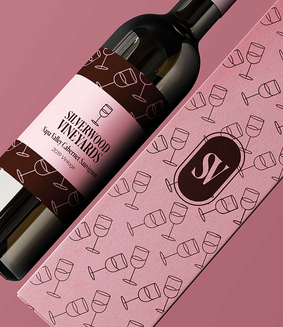 Bottle with deep burgundy label — elegant packaging design for beauty or hospitality client.