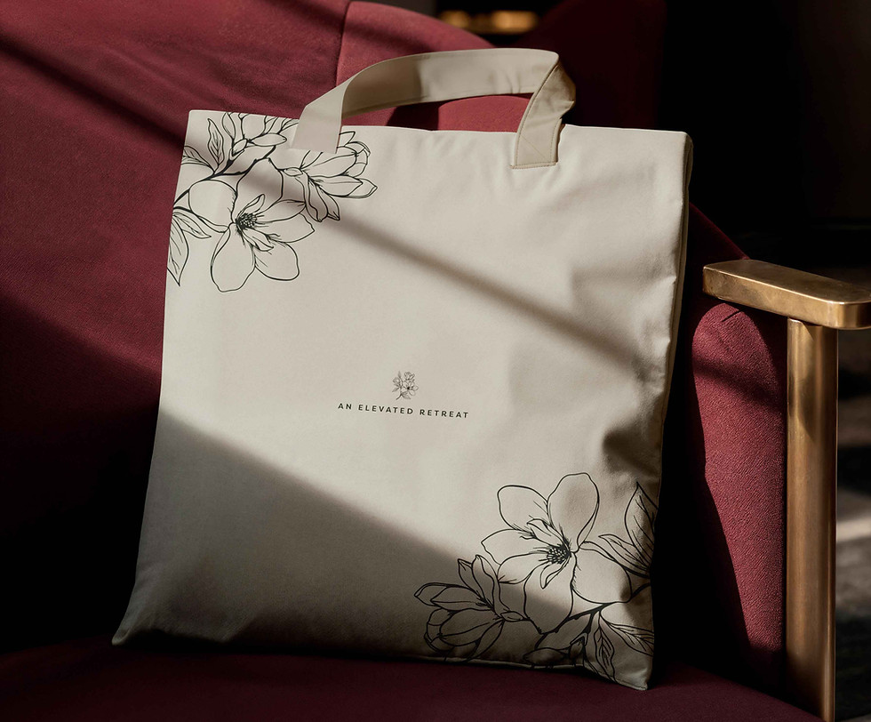 Canvas tote bag with floral print — branded lifestyle accessory for luxury retreat identity.