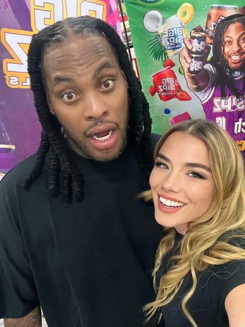 Brand ambassador with a celebrity creator at an activation