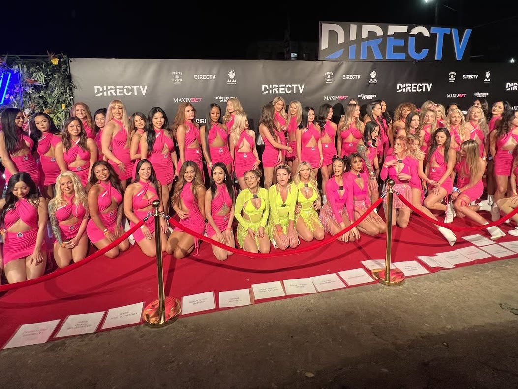 The full staffed team on the carpet at the MAXIM Big Game experience