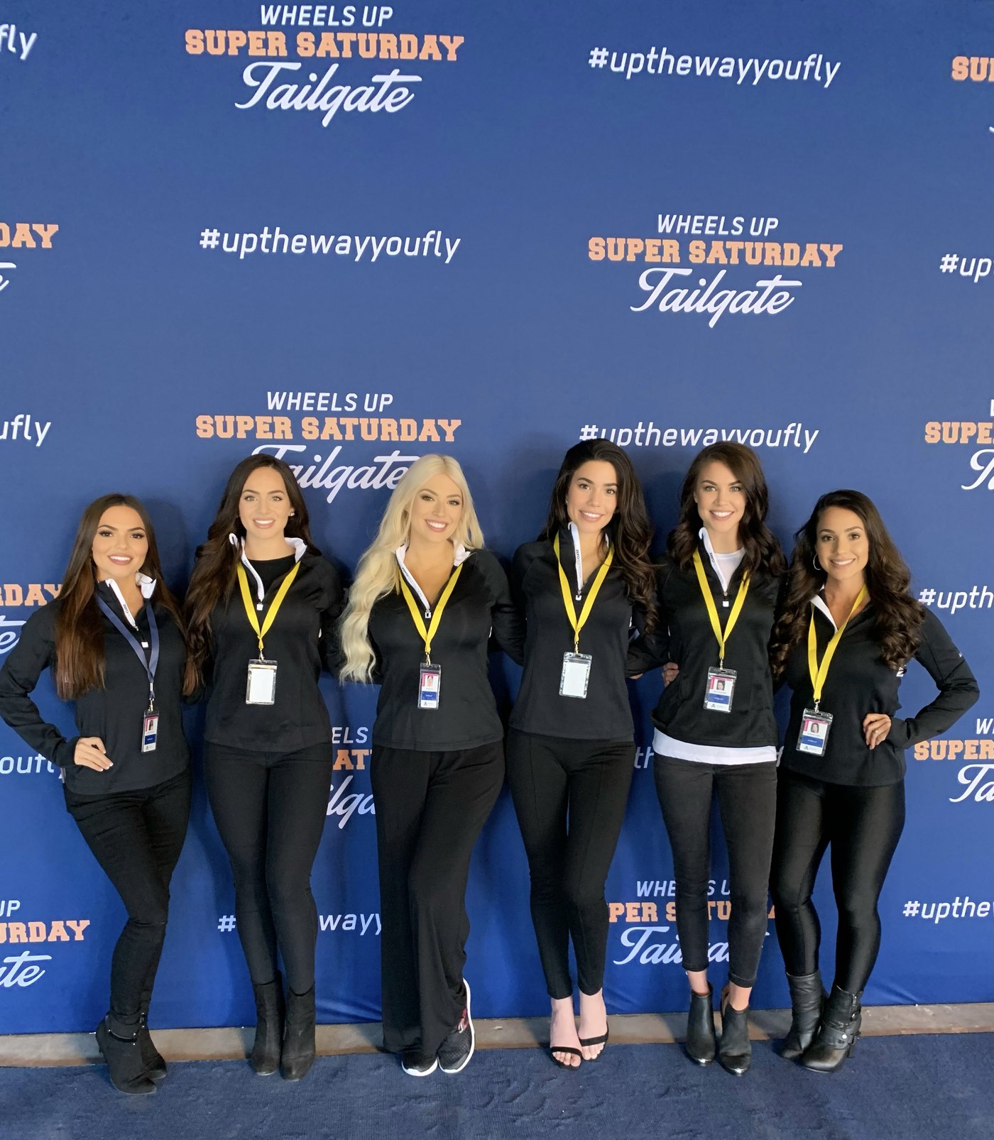 An Ashley Avery Agency staffing team in matched uniforms and event credentials at a Wheels Up client activation