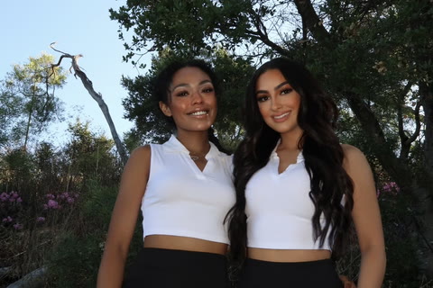 Promotional models in branded polo uniform at an outdoor activation