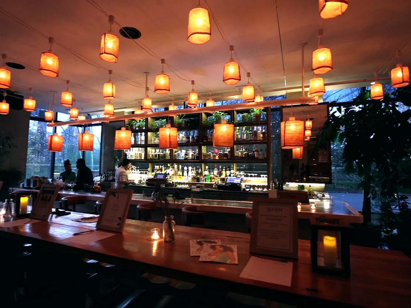 The bar and dining room at The Osprey lit and set before service for the Maxim cover party