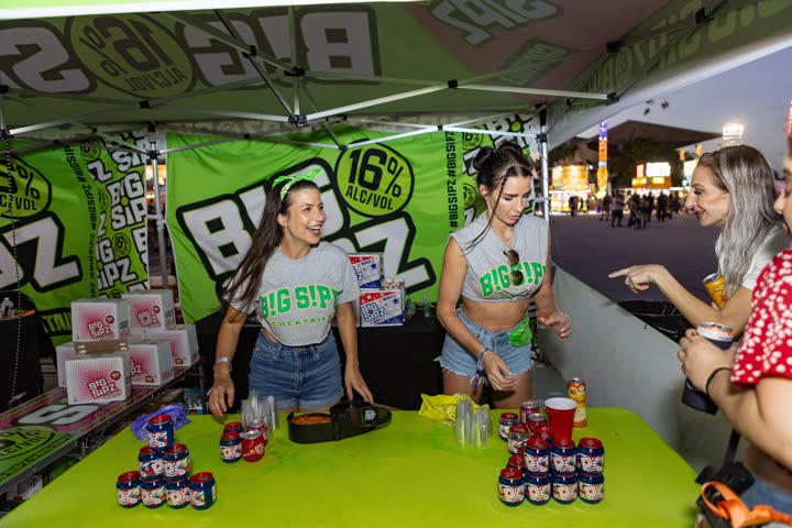 Sampling staff serving guests at the branded Big Sipz tent during a festival activation