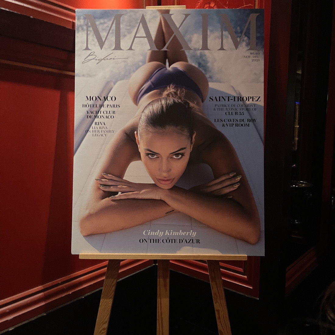 A Maxim cover displayed on an easel in London