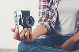 young-hipster-photographer-hand-holding-