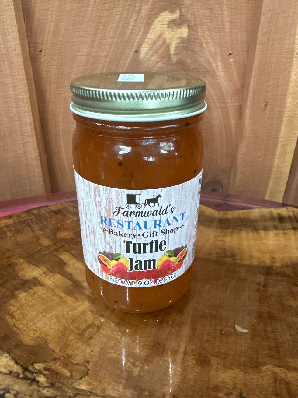 9oz Farmwald's Restaurant Turtle Jam jar on wood surface