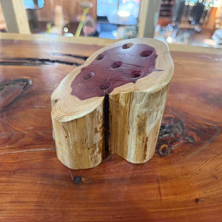 Amish handcrafted cedar pencil holder on a wood surface.