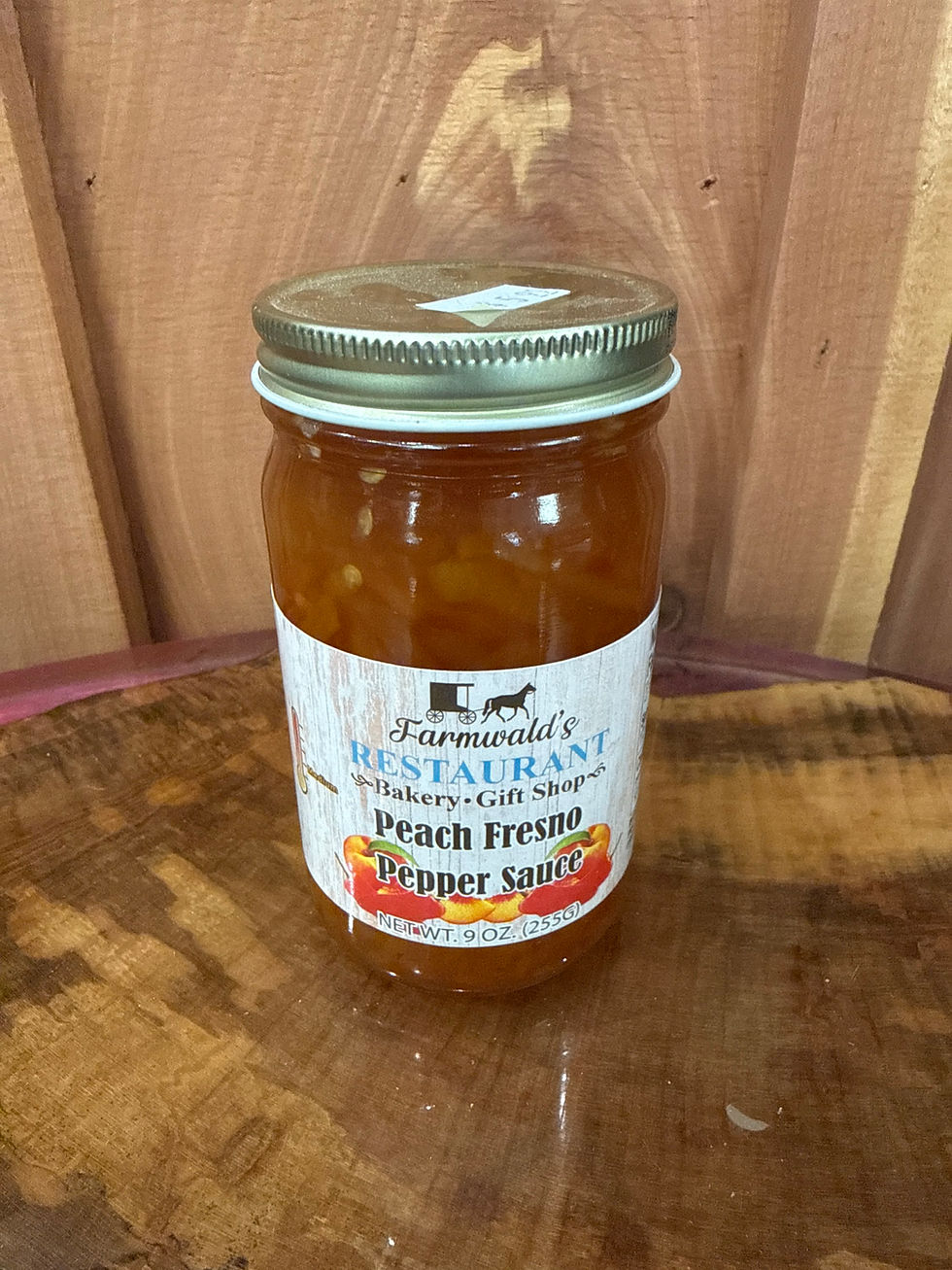 Farmwald's Peach Fresno Pepper Sauce 9oz jar on wood