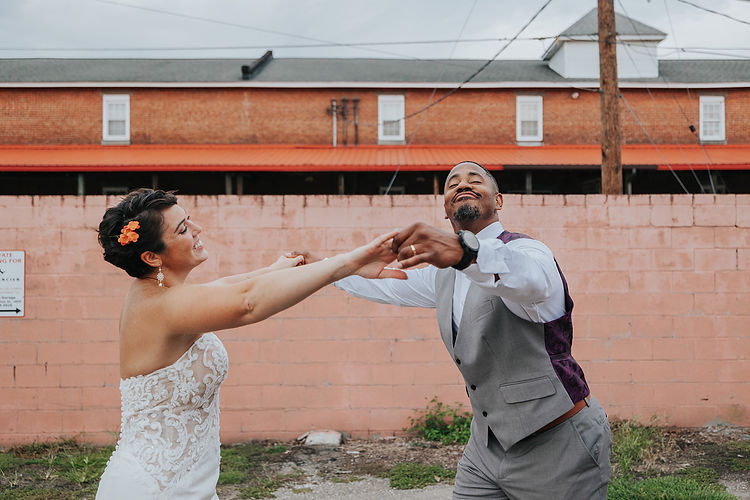a bride and groom dancing and having fun on their wedding day in pittsburgh