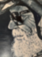 Painting of man's profile with white beard and glasses
