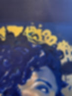 Textured blue abstract painting with gold accents