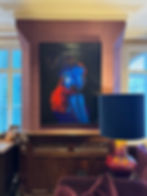 Painting of woman's profile in blue & red light