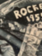 Earlier works artwork detail: 'ROCKET 195X' text