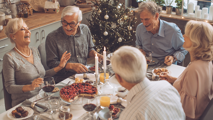 Family gathering at Christmas dinner with a home carer