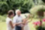 Home carer with elderly man in the garden