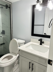 Finished three-piece bathroom with standing shower