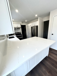 Custom kitchen pantry with garage door to hide appliances