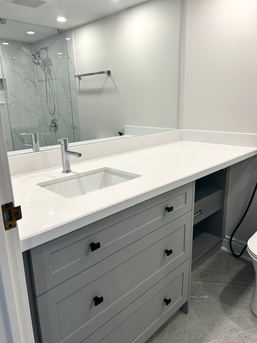 Custom vanity with quartz countertop for a downtown condo