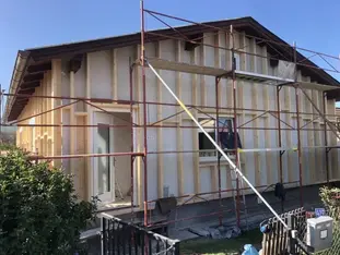 Facade renovation reference project, with blown-in straw.