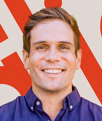 Headshot of Zach Giglio, co-founder of GCM, AI strategist, and keynote speaker, smiling in a navy blue shirt