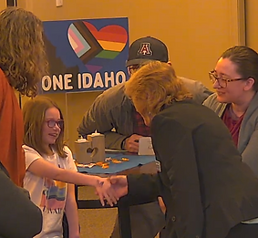 jae shaking hands with a kiddo.png