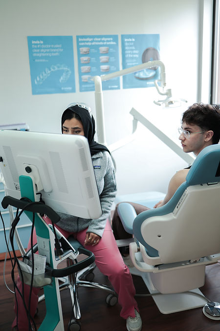 Dr. Anusha Atique talking with a patient about teeth whitening in Danbury, CT